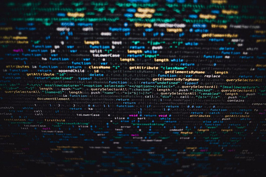 An abstract view of colorful computer code on a screen.