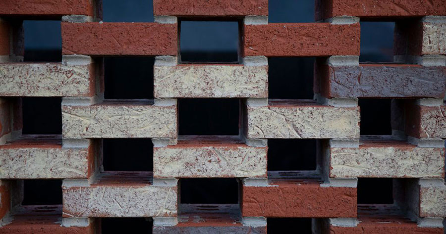 Brick stacked in an alternating and open grid pattern.