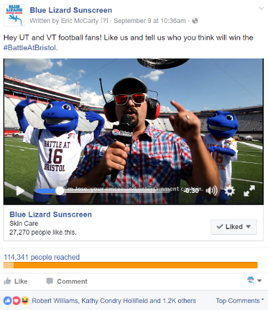 A screenshot from a Facebook posts. Jose Castillo stands int he middle of a football field with Blue Lizard mascots behind him.