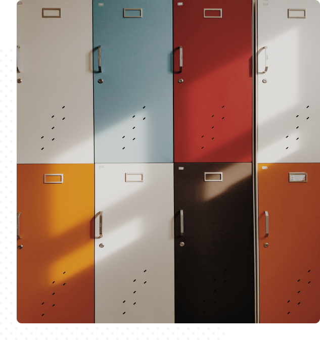 Abstract image of various colored lockers—white, blue, red, yellow, black, and orange.