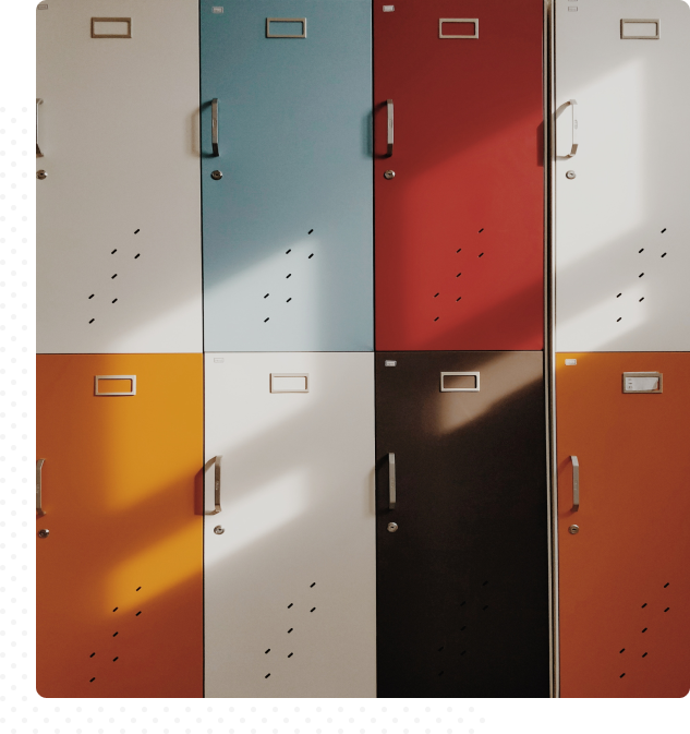 Group 148(3) Abstract image of various colored lockers—white, blue, red, yellow, black, and orange.